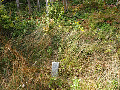 Eyelevel view of the disk on top of the granite post