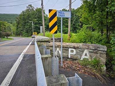 Looking SW at the opposite corner of the bridge from the mark's location. We like the WPA signage!