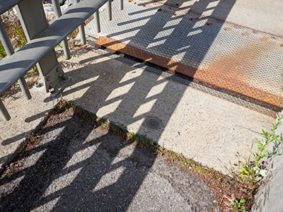 Eyelevel view of the disk on the sidewalk