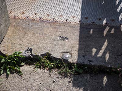 Eyelevel view of the disk in the sidewalk